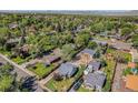 A peaceful neighborhood setting with mature trees surrounds this charming home, offering a serene suburban lifestyle at 4635 Teller St, Wheat Ridge, CO 80033