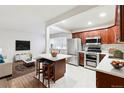 Modern kitchen with updated cabinetry, stainless steel appliances, and an island at 1101 Bellaire St # 108, Denver, CO 80220