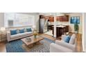 Open concept living space with wood floors and kitchen views at 1101 Bellaire St # 108, Denver, CO 80220