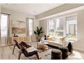 Inviting living room with large windows, contemporary furnishings, and ample sunlight at 8260 E 36Th Ave # 29, Denver, CO 80238