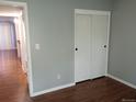 Bedroom with closet and wood flooring, freshly painted at 10792 E Exposition Ave Ave # 254, Aurora, CO 80012