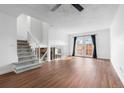 Bright and airy living room with high ceilings, access to the patio, and modern plank flooring at 5721 W 92Nd Ave # 52, Westminster, CO 80031