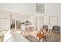 Open concept living room with kitchen and island at 17990 E Dickenson Pl, Aurora, CO 80013