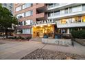 Welcoming entryway to the Gotham building, featuring brickwork and ample lighting at 1196 N Grant St # 501, Denver, CO 80203