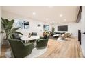 Spacious living room with hardwood floors and large windows at 10751 W 66Th Ave, Arvada, CO 80004