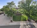 Beautiful two-story home with mature trees, a well-manicured lawn, and appealing landscaping at 874 Mercury Cir, Lone Tree, CO 80124