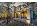 Charming front porch with room for seating on a lovely, well-maintained home at 20148 E Windy Pine Pl, Parker, CO 80134