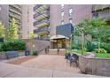 The building's entrance features a covered walkway and manicured landscaping at 480 S Marion Pkwy # 901, Denver, CO 80209