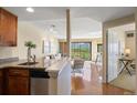 Open floor plan view of the living room with balcony and city views from the kitchen at 100 Park W Ave # 301, Denver, CO 80205