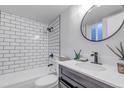 Modern bathroom with subway tile shower, sleek fixtures, and contemporary design at 3047 W 47Th Ave # 105, Denver, CO 80211
