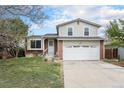 Charming two-story home with landscaped yard and a two car garage in a quiet neighborhood at 19707 E Princeton Pl, Aurora, CO 80013