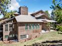 This two-story home offers large windows for natural light and beautiful wood siding at 18940 Pebble Beach Way, Monument, CO 80132