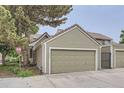 Attached two-car garage providing convenient parking and storage space with an adjacent gated area at 2299 Ranch Dr, Westminster, CO 80234