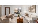 Inviting living room offering ample natural light, contemporary furnishings, and a serene atmosphere at 7484 E Princeton Ave, Denver, CO 80237