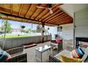 Inviting covered patio with comfortable seating, perfect for outdoor entertaining at 14185 W 50Th Ave, Golden, CO 80403