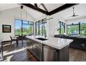 Modern kitchen with island, stainless steel appliances, and mountain views at 52 West Point Lode # A, Breckenridge, CO 80424