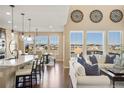 Bright, open living space with hardwood floors, lots of natural light and vaulted ceilings at 10055 Fort Worth Ct, Parker, CO 80134
