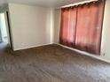 Cozy living room with neutral walls and carpet at 3054 Victor St, Aurora, CO 80011