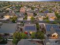 Expansive aerial view of a residential community with many homes featuring solar panels at 5471 Ensenada Ct, Denver, CO 80249