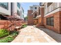 Exterior patio and walkway leading to modern brick townhomes with beautiful architectural details at 1824 Pearl St # B, Boulder, CO 80302
