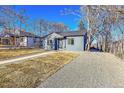 Newly remodeled bungalow featuring a fresh coat of paint and updated landscaping at 1361 W Custer Pl, Denver, CO 80223