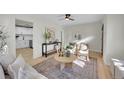 Open concept living room with views into the updated kitchen at 1361 W Custer Pl, Denver, CO 80223