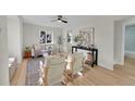 Bright and airy living room with hardwood floors and ample natural light at 1361 W Custer Pl, Denver, CO 80223