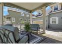 Inviting porch with comfortable seating area, perfect for relaxing and enjoying the outdoors with a nice striped rug at 3342 Springmeadow Cir, Castle Rock, CO 80109
