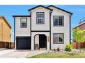 Inviting exterior featuring a two-story home with black trim, landscaped yard, and a cozy front porch at 10042 Hudson St, Thornton, CO 80229