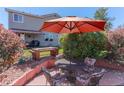 The backyard patio features ample seating, perfect for outdoor dining and entertaining at 10057 Cedaridge Way, Highlands Ranch, CO 80129