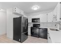 Modern kitchen with stainless steel appliances, white countertops, and stylish backsplash at 595 S Alton Way # 1C, Denver, CO 80247