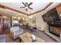 Spacious living room with a dining area, fireplace, comfortable furniture, and an open layout to the kitchen at 1521 Ski Hill Rd # 8318, Breckenridge, CO 80424