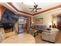 Cozy living room with a fireplace, television, comfortable seating, and access to a balcony at 1521 Ski Hill Rd # 8318, Breckenridge, CO 80424