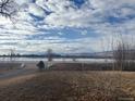Tranquil lakefront property with mountain views at 6397 Ute Hwy, Longmont, CO 80503