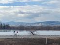 Scenic view of lake and distant mountains at 6397 Ute Hwy, Longmont, CO 80503
