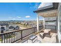 Outdoor deck area offering scenic views, perfect for relaxation and entertaining at 6586 S Lewis Ct, Littleton, CO 80127