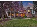 Charming brick home with mature trees and a well-maintained lawn in a desirable neighborhood at 239 Ash St, Denver, CO 80220