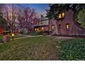 Beautifully landscaped front yard with a classic brick home and inviting curb appeal at 239 Ash St, Denver, CO 80220