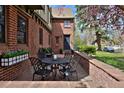 Charming outdoor patio features a table and chairs for relaxation and entertaining at 239 Ash St, Denver, CO 80220
