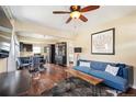 Spacious living room and dining area with hardwood floors, plenty of natural light and an open floor plan at 3336 W 35Th Ave, Denver, CO 80211