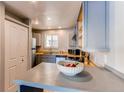Efficient kitchen featuring modern appliances, ample counter space, and bright natural light at 4246 S Eldridge St # 103, Morrison, CO 80465