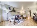 Bright living room featuring hardwood floors, stylish furniture, and elegant decor at 1292 Kearney St, Denver, CO 80220