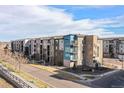 Modern apartment complex boasts varied architectural styles and well-maintained landscaping at 400 E Fremont Pl # 205, Littleton, CO 80122
