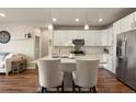 Charming kitchen with a center island, stainless steel appliances, and ample storage space at 400 E Fremont Pl # 205, Littleton, CO 80122