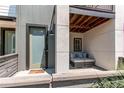 Inviting entryway featuring a cozy seating area and a modern front door at 8361 Parkland St, Broomfield, CO 80021