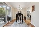 Dining area with sliding glass doors leading to the backyard and open to the kitchen at 3343 S Monaco Pkwy # A, Denver, CO 80222