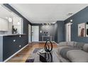 Stylish living room showcasing modern lighting, hardwood flooring, and elegant furnishings at 525 Jackson St # 304, Denver, CO 80206