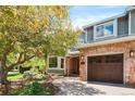 Attractive home featuring a brick facade, attached garage, and well-maintained front yard at 2345 Spotswood Pl, Boulder, CO 80304