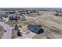 Aerial view of a home in a neighborhood with mountain views at 14701 Yosemite St, Brighton, CO 80602