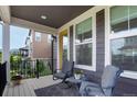 Cozy outdoor seating area with a gray rug and chairs to sit and relax at 8958 Southurst St, Littleton, CO 80129